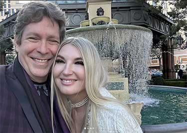 Mark Malatesta and Ingrid Elfver in front of water fountain